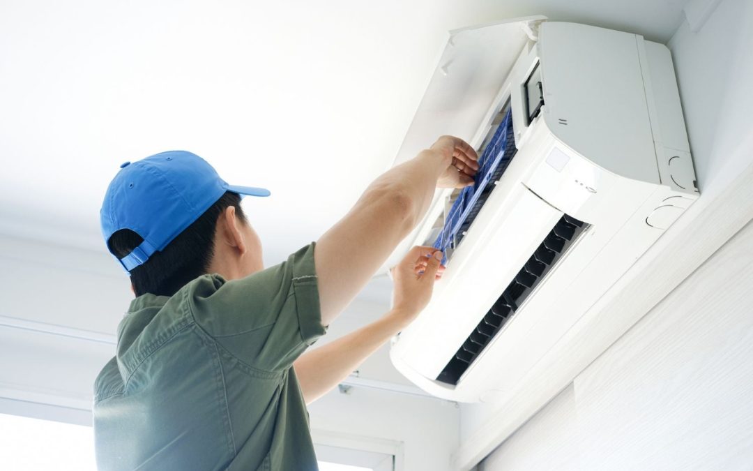 HVAC technician servicing a ductless mini split in Beverly Hills