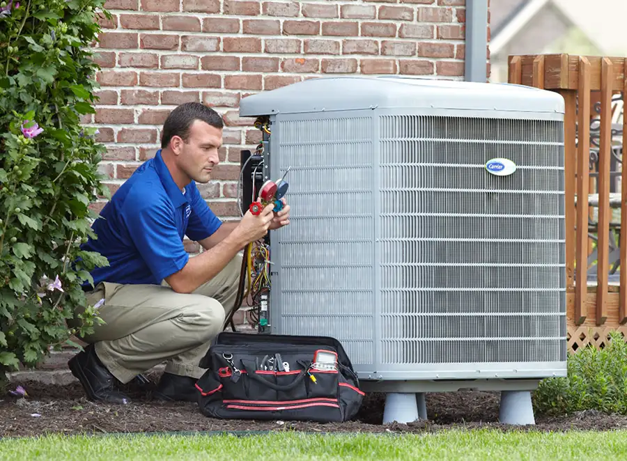 HVAC technician inspecting an outdoor AC unit in Beverly Hills