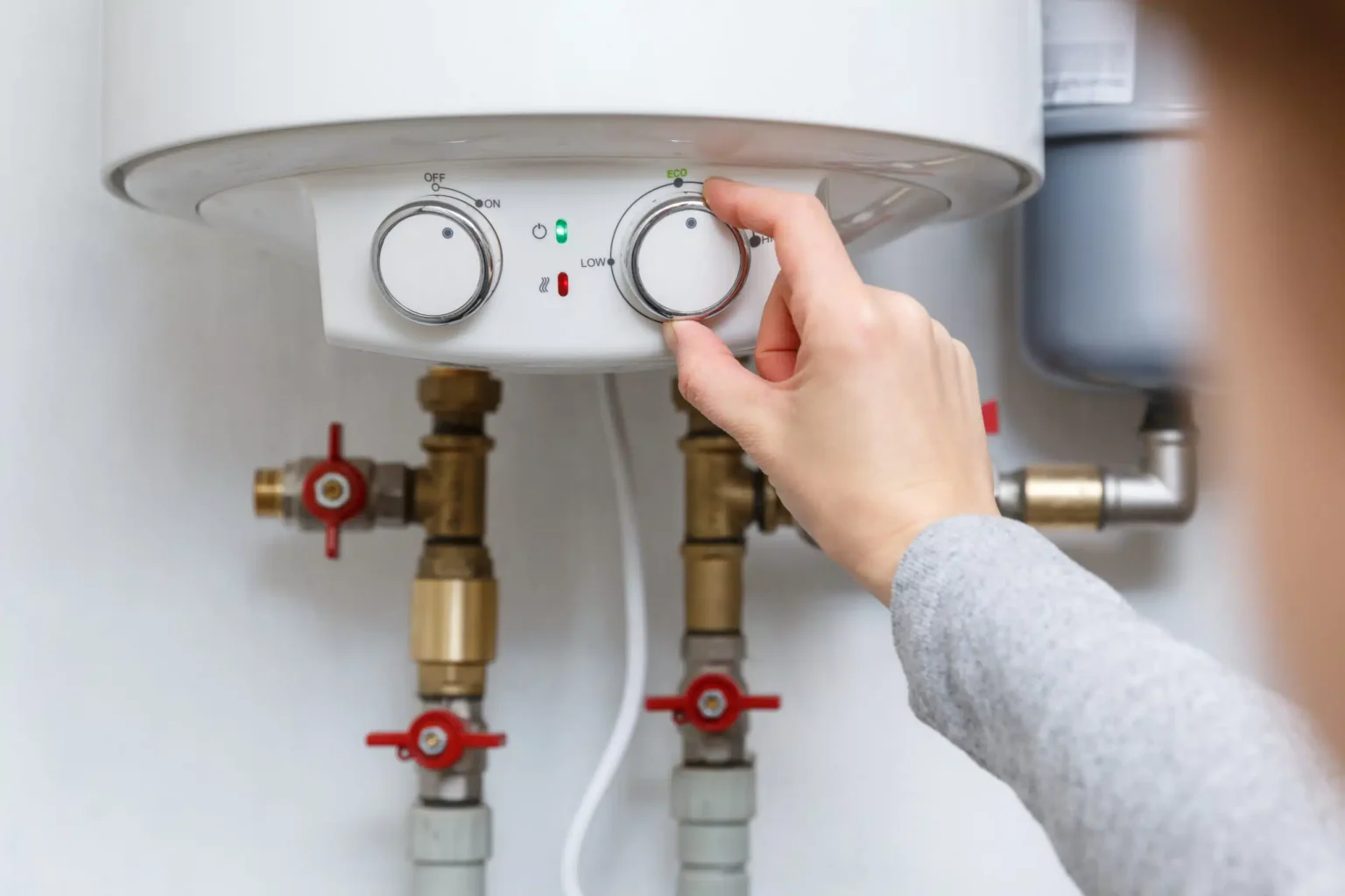 Technician adjusting a water heater in Beverly Hills